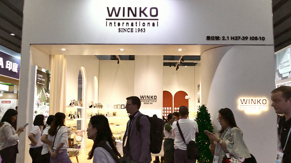 Winko stand at Canton Fair 2026 Phase 2, Hall 2.1 — warm-toned display featuring Woven Glow and Delft Blue Linen collections