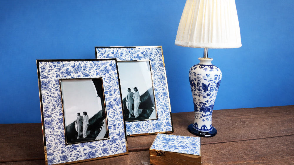Winko Delft Blue Linen FW26 collection — ceramic base LED table lamp, fabric accent trinket box and photo frame combining ceramic, linen and metal materials