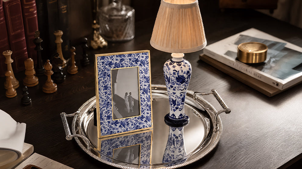 Winko Delft Blue Linen and Woven Glow cross-selling display — fabric accent trinket box, photo frame and gold metalware serving tray as coordinated retail grouping