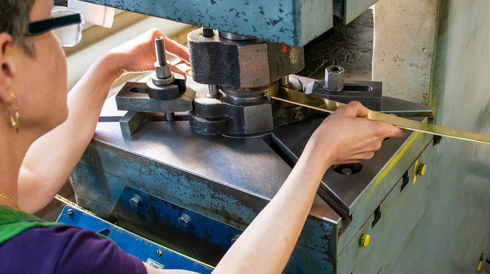 Stainless steel tabletop manufacturer stamping process — coil feeding into production line for custom stamped stainless steel tray range