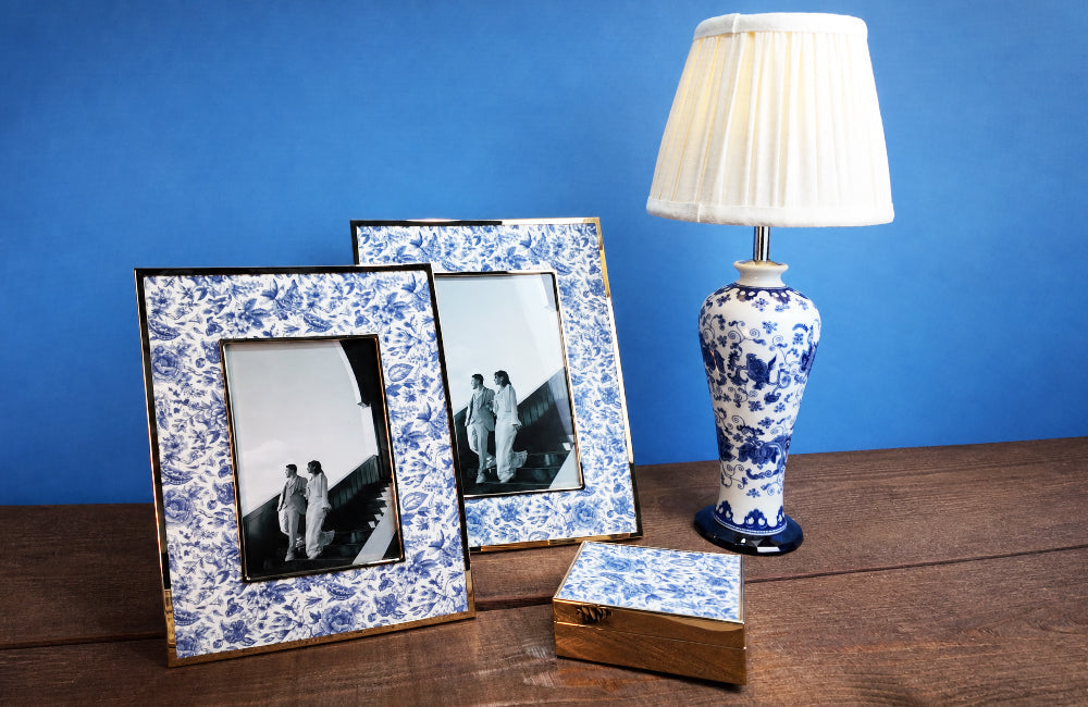 Winko Delft Blue Linen FW26 collection — ceramic base LED table lamp, fabric accent trinket box and photo frame combining ceramic, linen and metal materials
