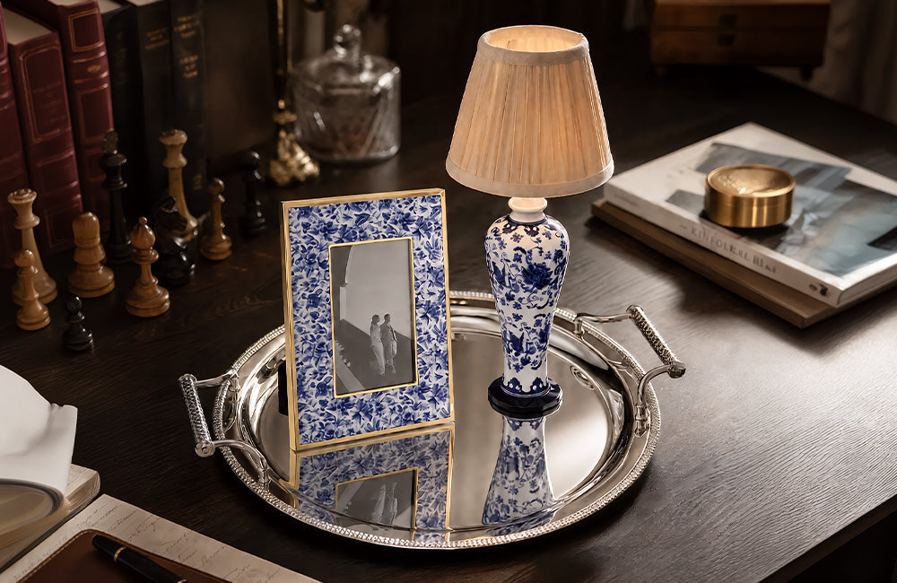 Winko Delft Blue Linen and Woven Glow cross-selling display — fabric accent trinket box, photo frame and gold metalware serving tray as coordinated retail grouping